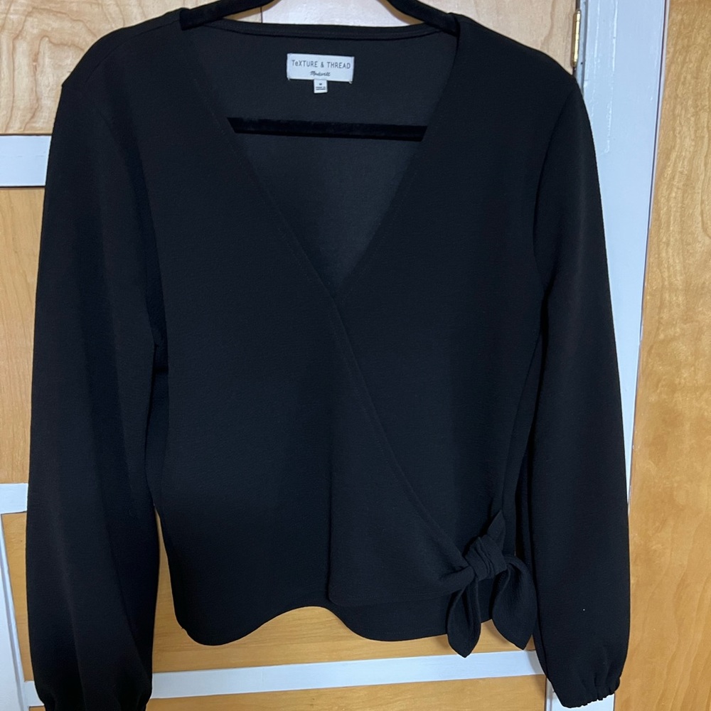 Madewell black top. Size Small. Faux wrap top with bow on left side.